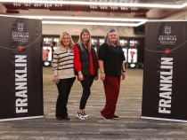 photo of three people in dressing room