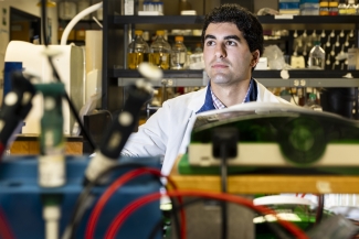 photo of man, with lab instruments in foreground