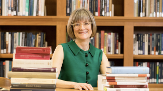 photo of woman with books