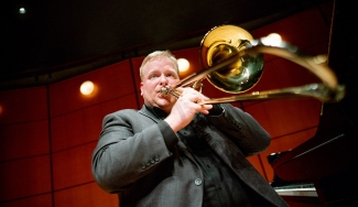 photo of man playing trombone