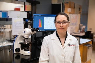 photo of woman in lab with computer 