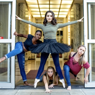 photo of four dancers posed at the library door