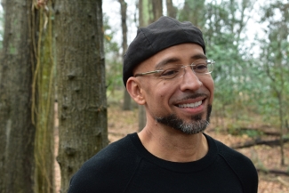 photo of man in forest, trees in background, day