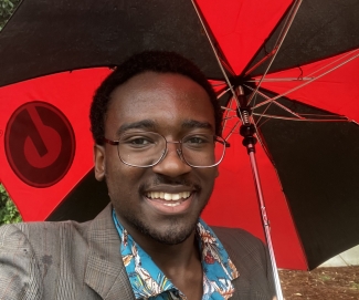 photo of man holding umbrella