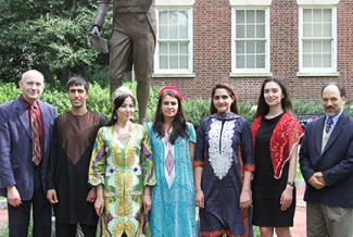 people outside with statue