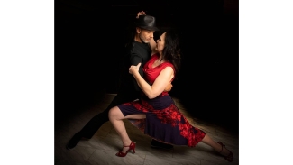 photo of two dancers with black background