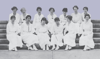 historical photo of women seated on steps