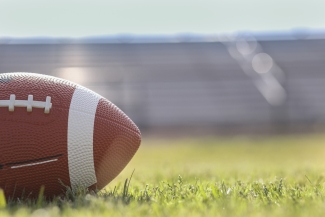 stock photo of football on grass field