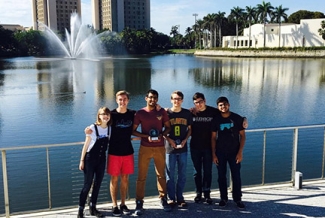 six people in front of water, photo