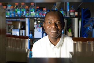 man in lab with bottles