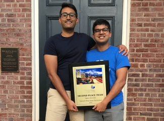 Pictured: Advait (left) and Swapnil with their 2nd place trophy.