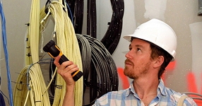 man in hard hat, with flashlight