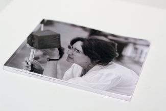 photo of a photo of woman holding pinhole camera