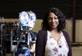 photo of woman, with lighting rig in background