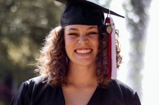 photo of woman in cap and gown