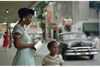 woman with girl near street