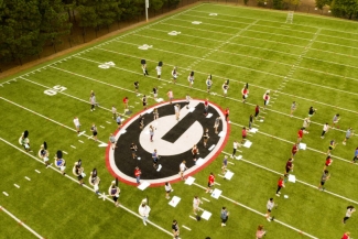 aerial photo of marching band practice