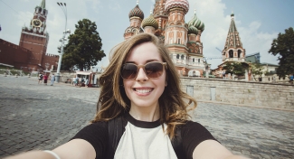 selfie photo of woman with orthodox cathedral in background