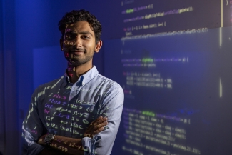 photo of man, with text projected on screen