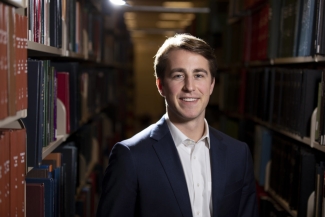 photo of man in library