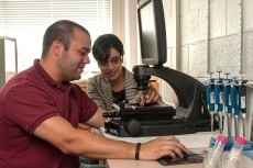 professor and her co-author in the lab.