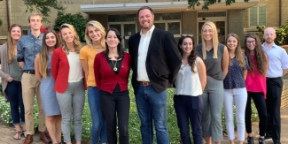 group photo of men and woman outdoors