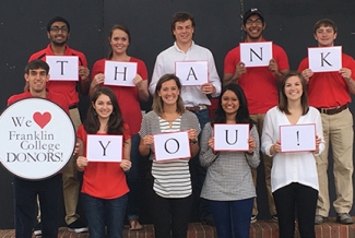 students with thank you signs