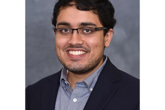 headshot of man with glasses