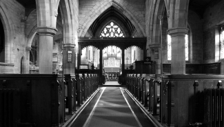 black and white photo of empty church sanctuary