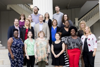 group photo on steps of the Hunter Holmes academic building