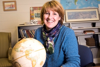 photo of woman with globe