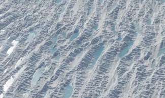 aerial photo of water puddles on glacier