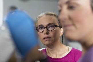 photo of woman, with blurred face in the foreground