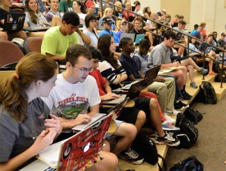 photo of students auditorium classroom with laptops