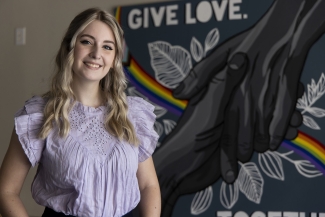 photo of woman with mural