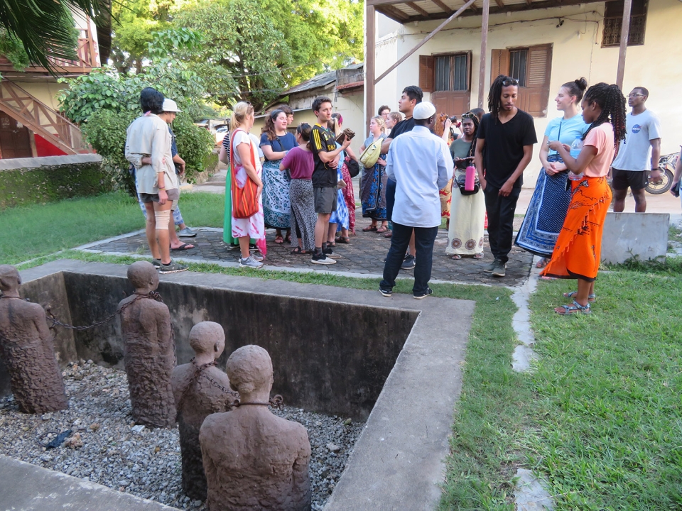 Students learning about the slave market outside the David Livingston Anglican Church in Stone Town