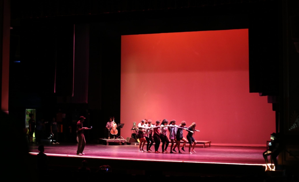 Students and musicians from the 2019 Maymester workshop rehearse on stage in the Fine Arts Theatre. Image by Shannah Montgomery