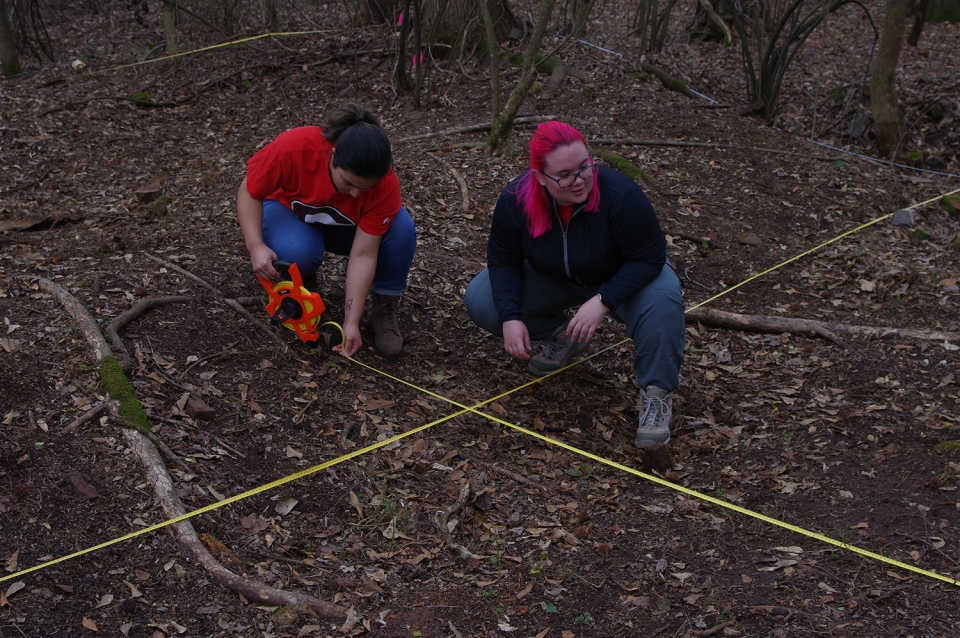 Students Erin Mulkey and Jasmine Rivera establish a grid across the site which allows archaeologists to better document and record the exact location for artifacts and features that can be seen on the surface.