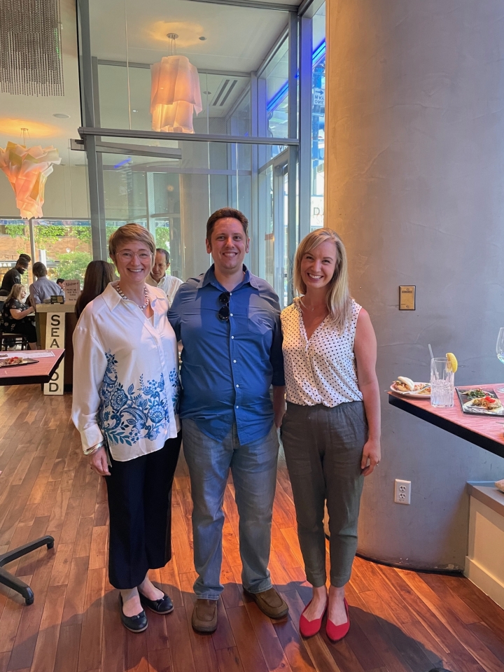 Dean Stenport, left, with Seattle alumni Davis Powell and Katy Ward