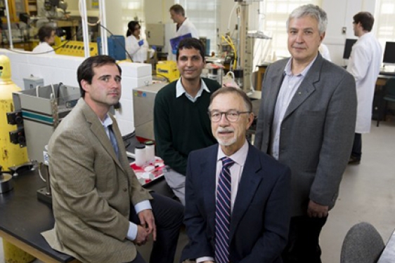 four men in a lab