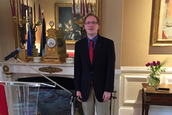 student in ornate room