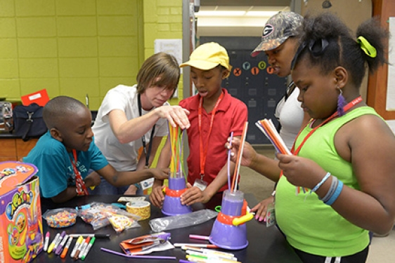 kids making art in a classroom