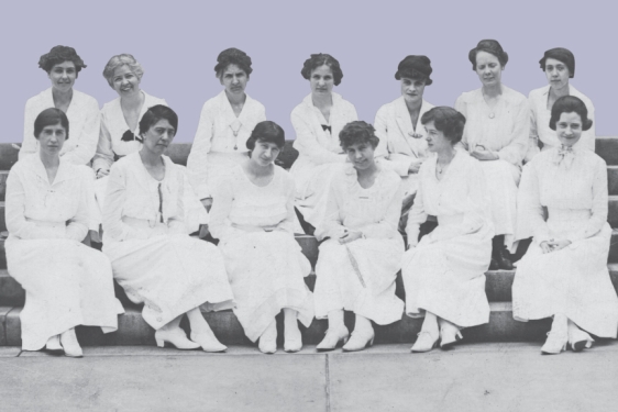 historical photo of women seated on steps