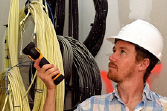 man in hard hat, with flashlight