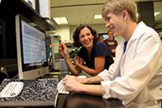 teacher and student with computer