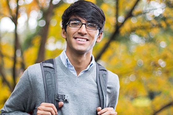 man outside with backpack