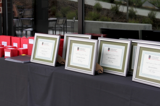 photo of table with framed certificates