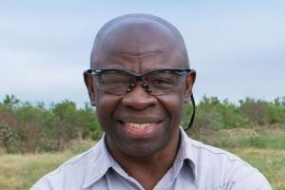 headshot photo of a man outdoors