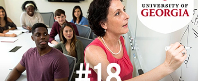 woman at board with students 