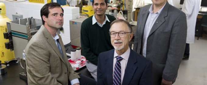 four men in a lab